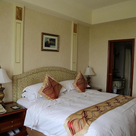 Huiquan Dynasty Hotel Циндао Номер фото