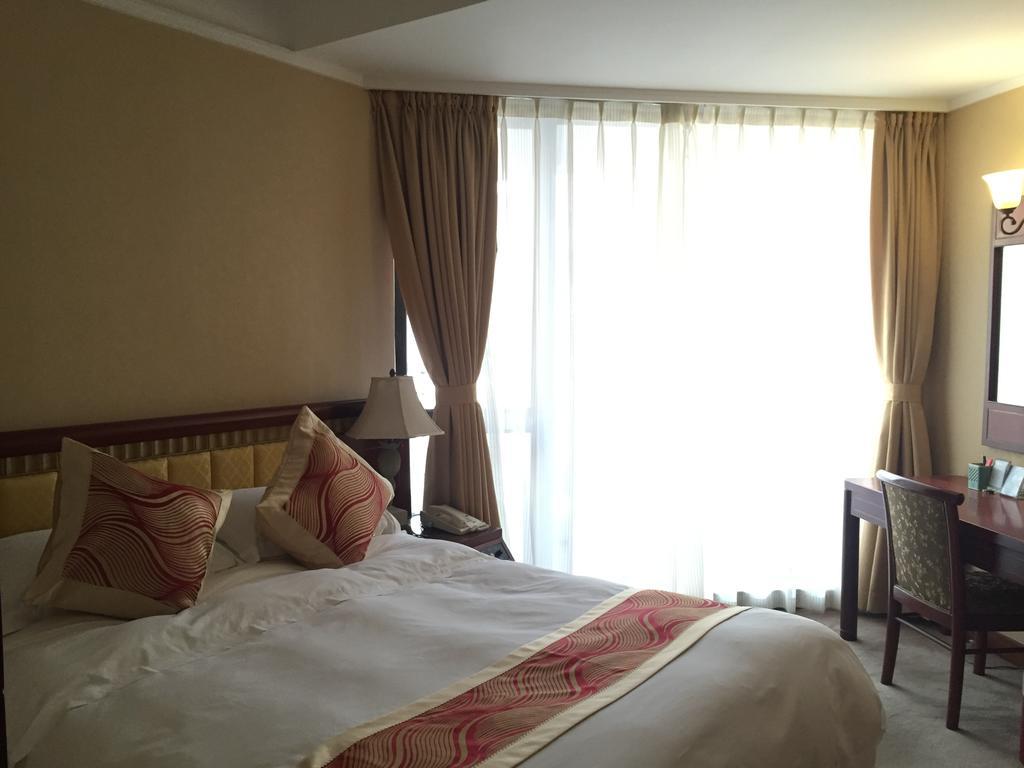 Huiquan Dynasty Hotel Циндао Экстерьер фото