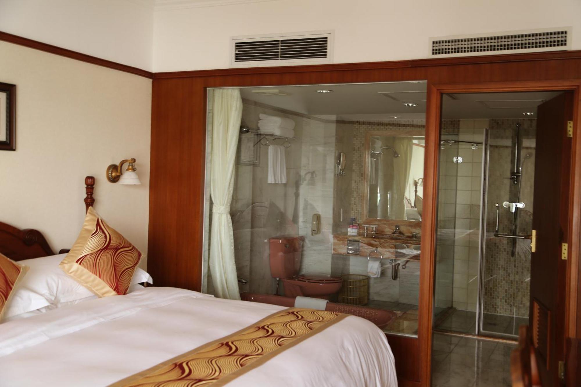Huiquan Dynasty Hotel Циндао Номер фото