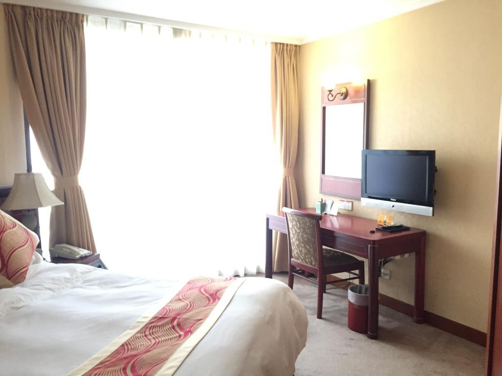 Huiquan Dynasty Hotel Циндао Экстерьер фото