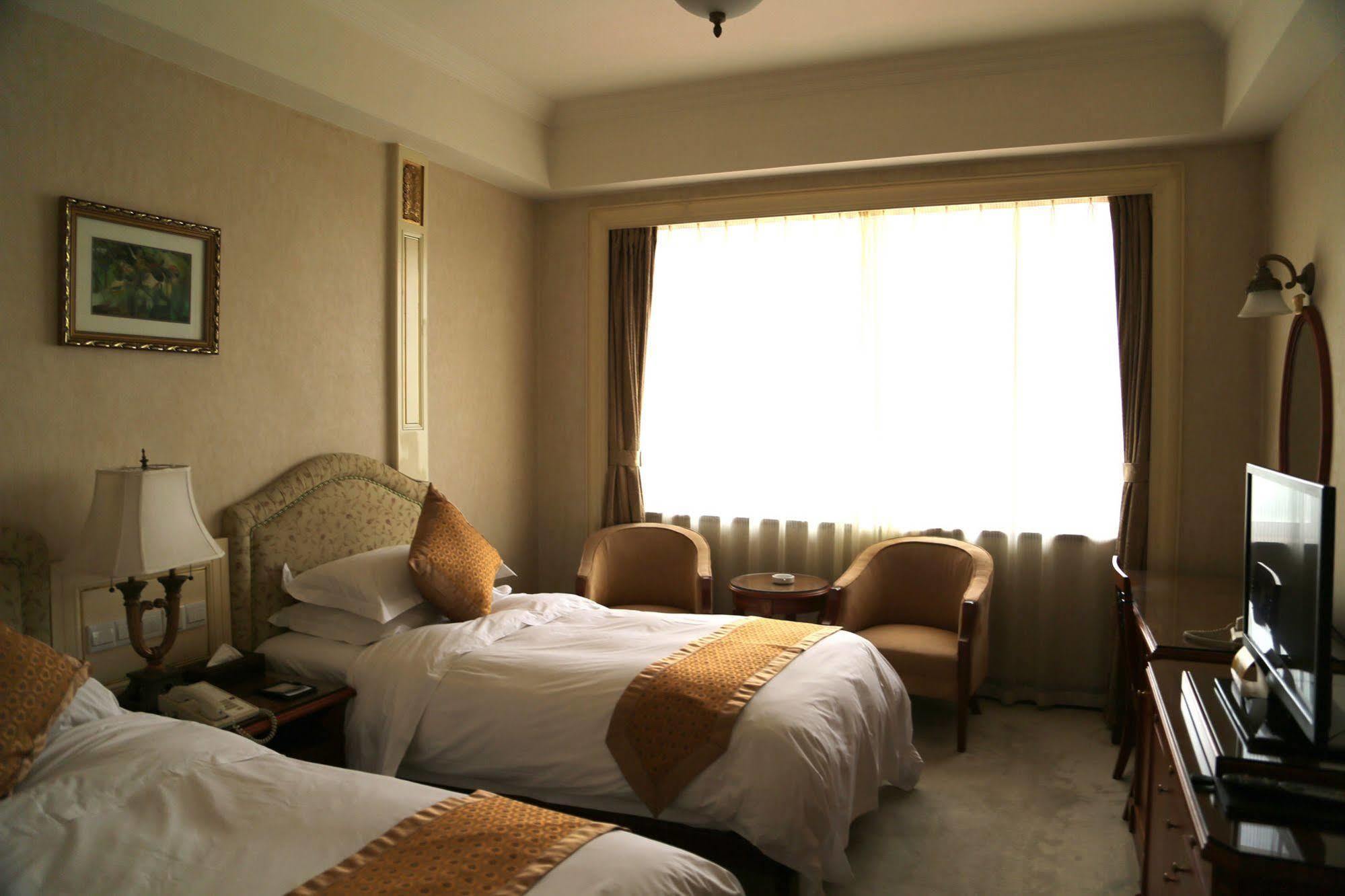 Huiquan Dynasty Hotel Циндао Экстерьер фото