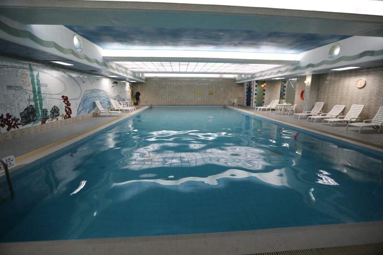 Huiquan Dynasty Hotel Циндао Экстерьер фото